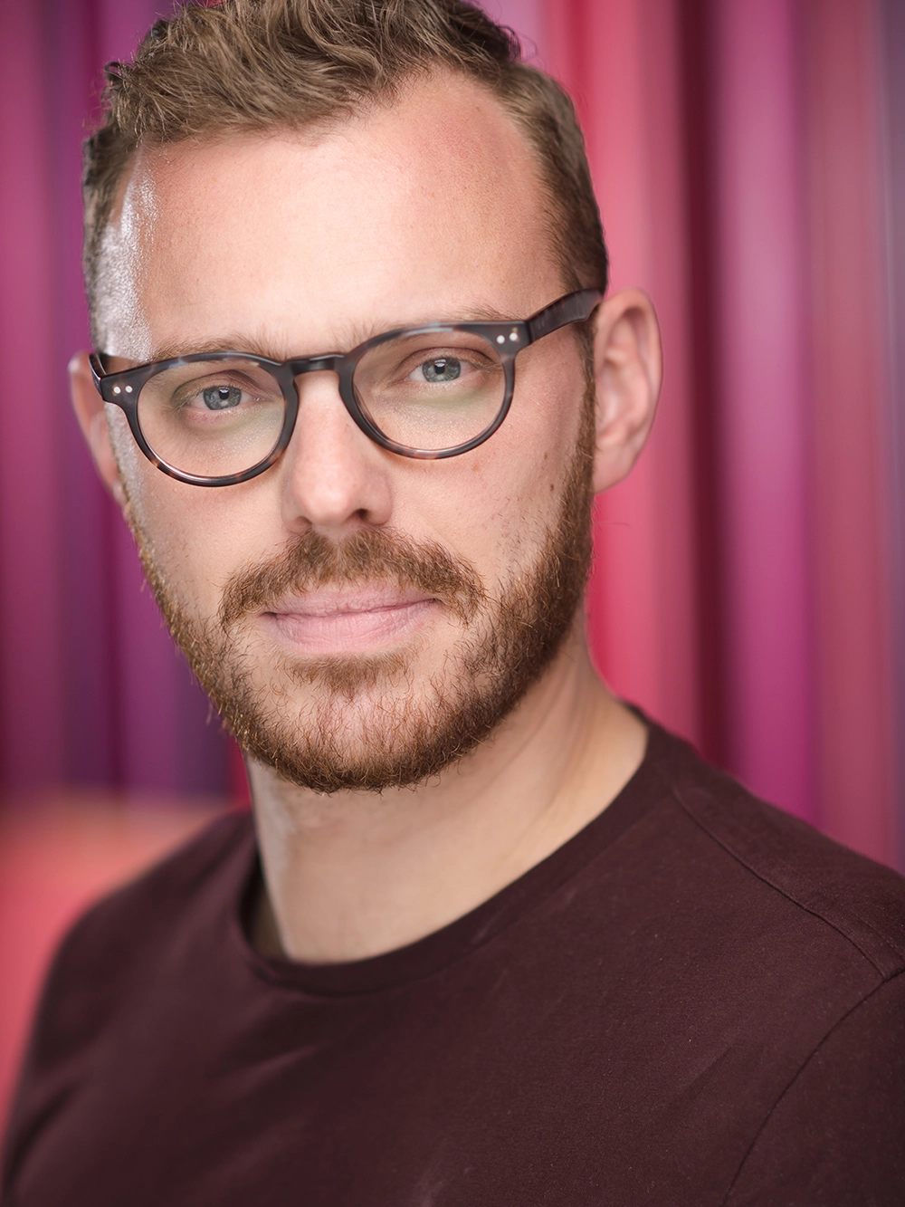 Modern male headshot retouching services with glasses.